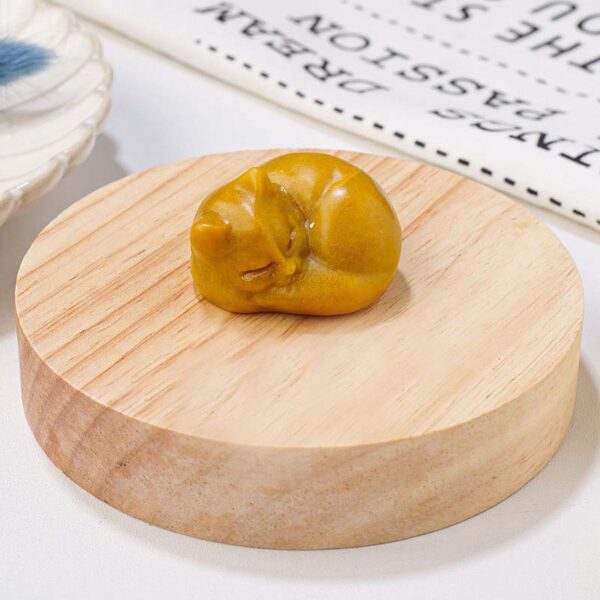 Crystal sleeping cat statue - orange-fancy calcite
