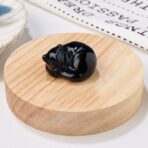 Crystal sleeping cat statue - black glossy obsidian